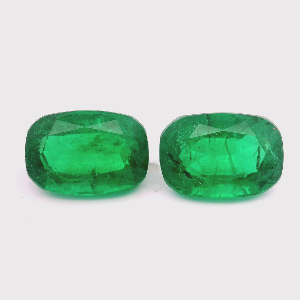 
                  
                    Load and play video in Gallery viewer, 12.84x8.88x6.27mm Cushion Emerald Pair (2 pc 10.61 ct)
                  
                