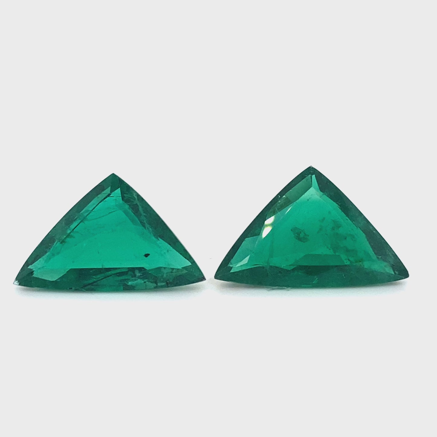 
                  
                    Load and play video in Gallery viewer, 25.98x16.46x7.65mm Fancy Cut Emerald (2 pc 30.20 ct)
                  
                