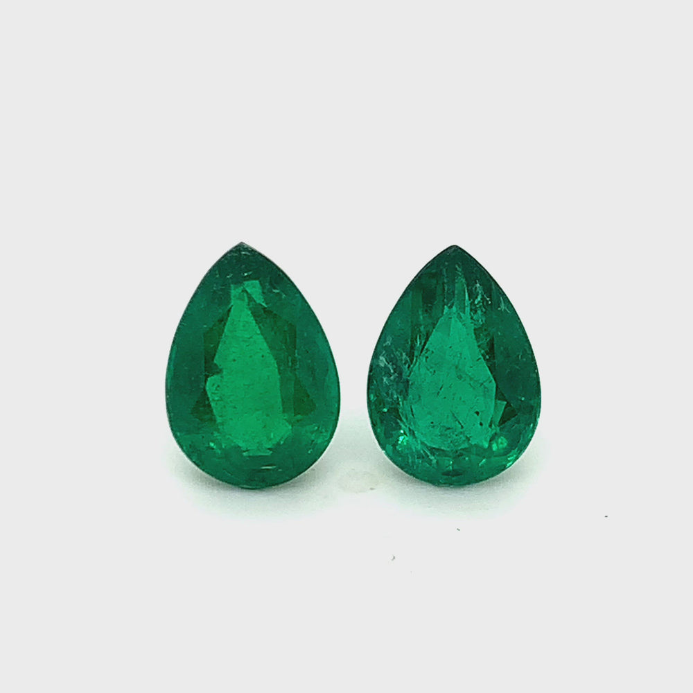
                  
                    Load and play video in Gallery viewer, 12.20x8.60x5.35mm Pear-shaped Emerald (2 pc 6.26 ct)
                  
                