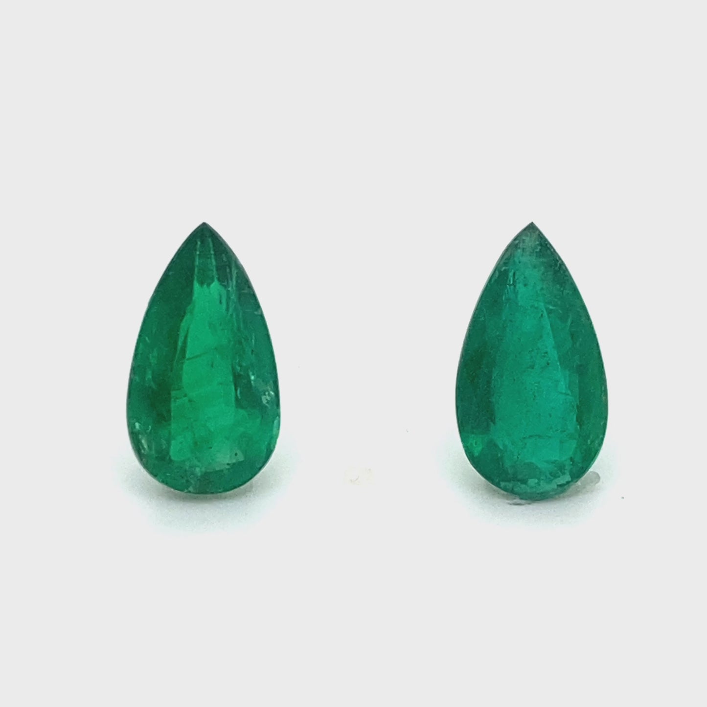 
                  
                    Load and play video in Gallery viewer, 13.50x7.50x0.00mm Pear-shaped Emerald (2 pc 6.06 ct)
                  
                