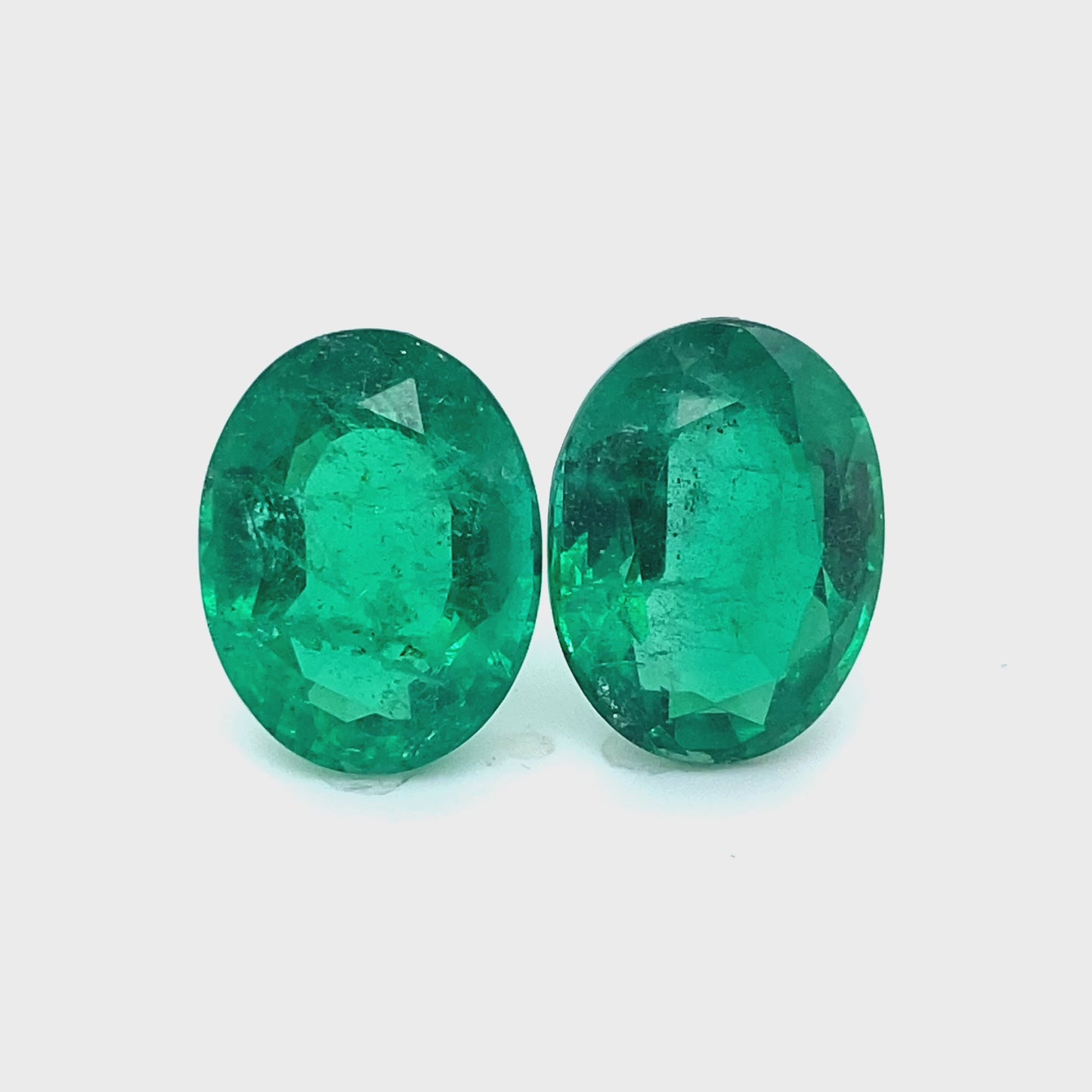 17.02x13.10x8.22mm Oval Emerald Pair (2 pc 22.94 ct)