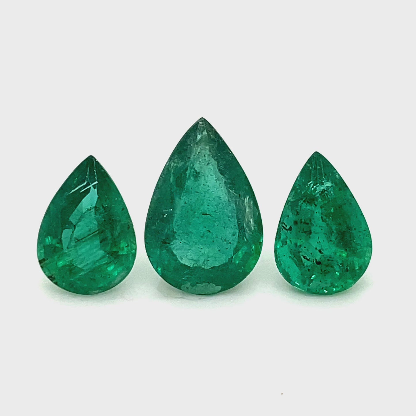 
                  
                    Load and play video in Gallery viewer, 11.00x6.00x0.00mm Pear-shaped Emerald (3 pc 9.63 ct)
                  
                